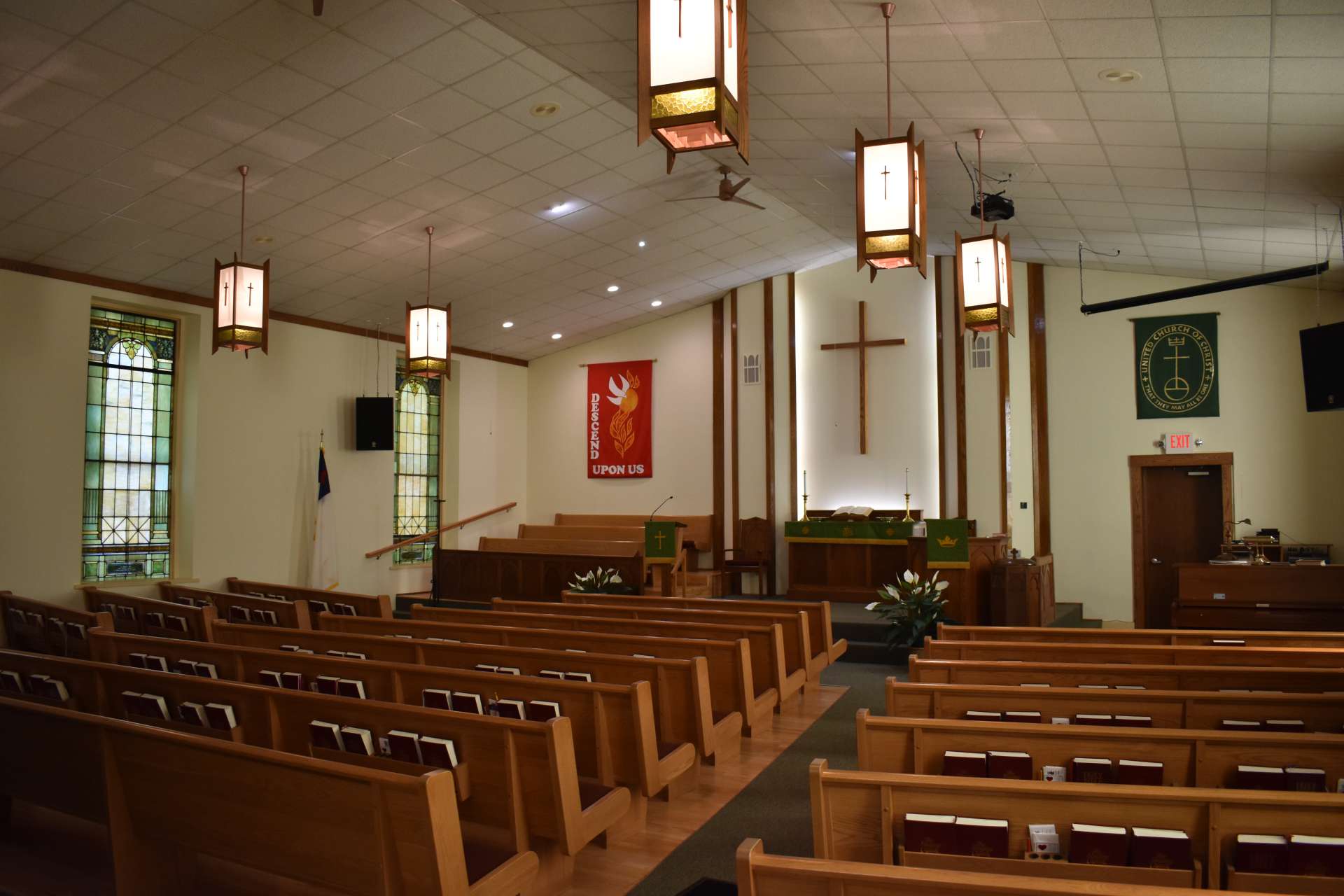 The Knob Prairie sanctuary with wooden pews and hanging lights